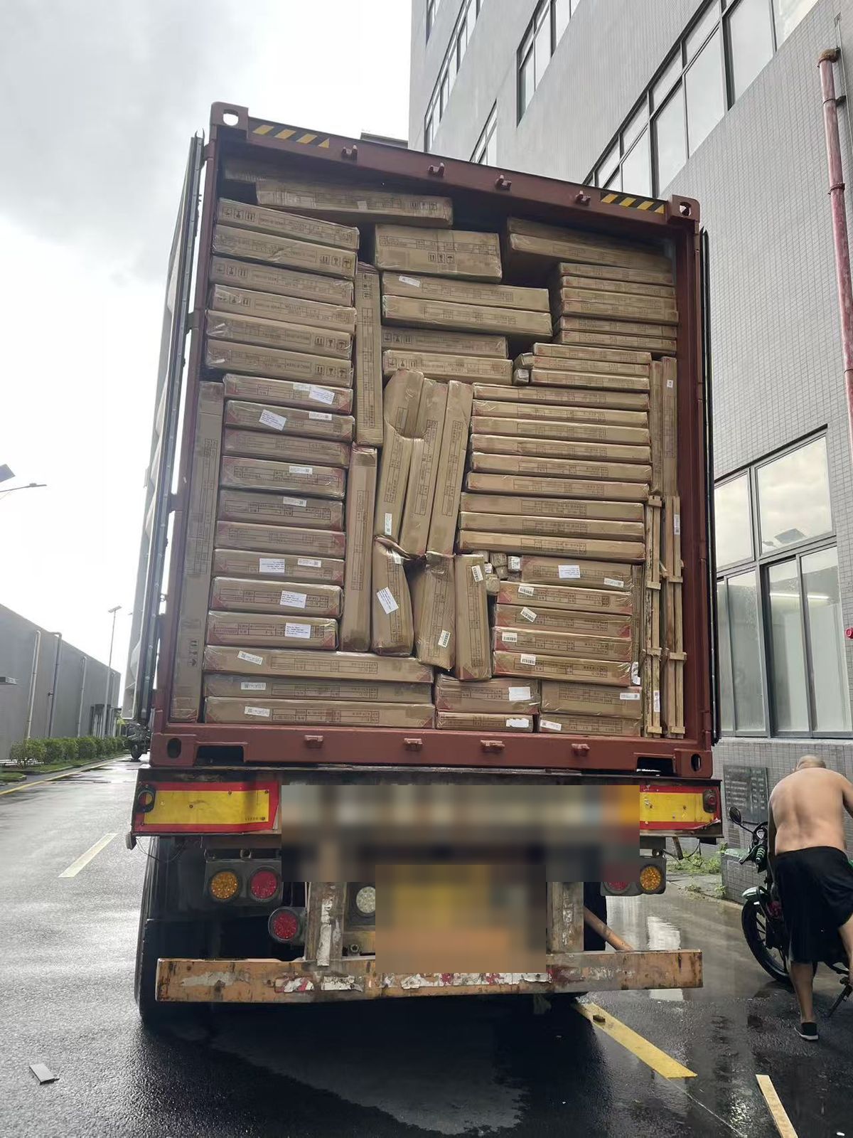 Container fully loaded with panel furniture